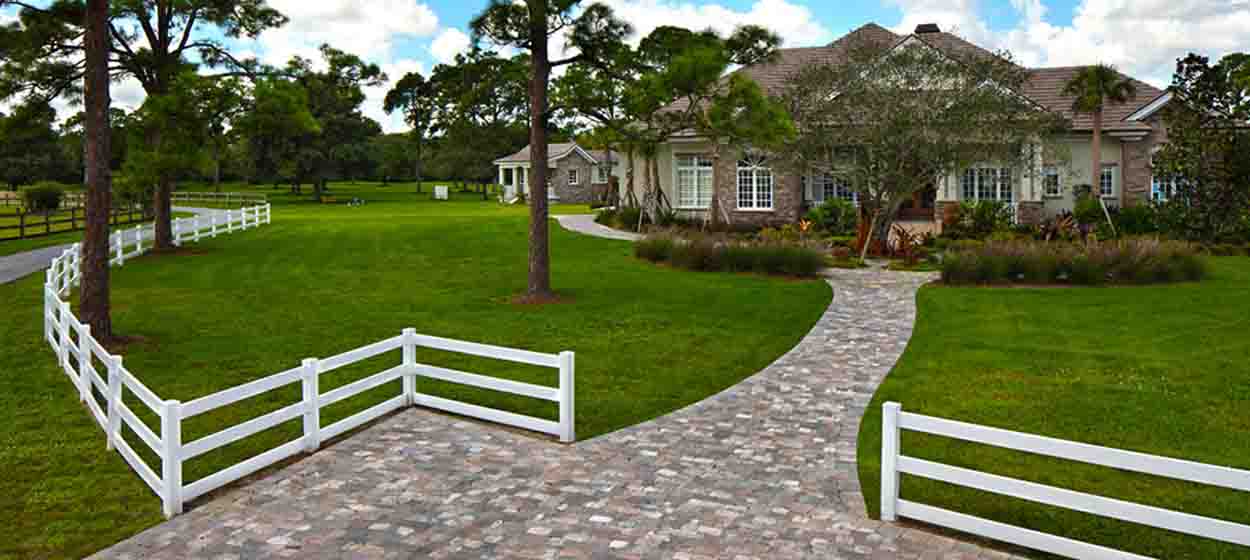 Cobble paver driveway and walkway approach to a Florida estate